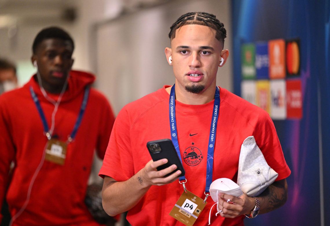 Noah Okafor pre-game for RB Salzburg, walking with his phone in his hand