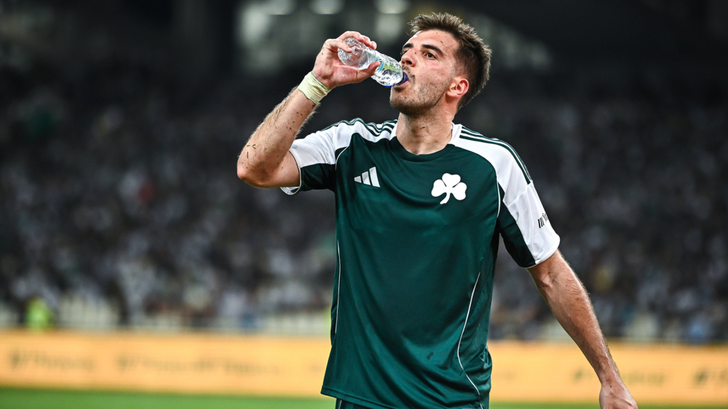 Leeds United target Fotis Ioannidis drinks from a bottle of water while in action for Panathinaikos.