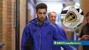Illia Gruev arriving at Elland Road, with a Leeds United flag in a circular frame