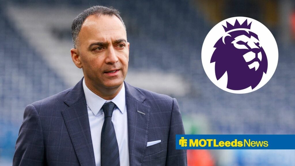 Paraag Marathe in suit in football stadium with Premier League badge