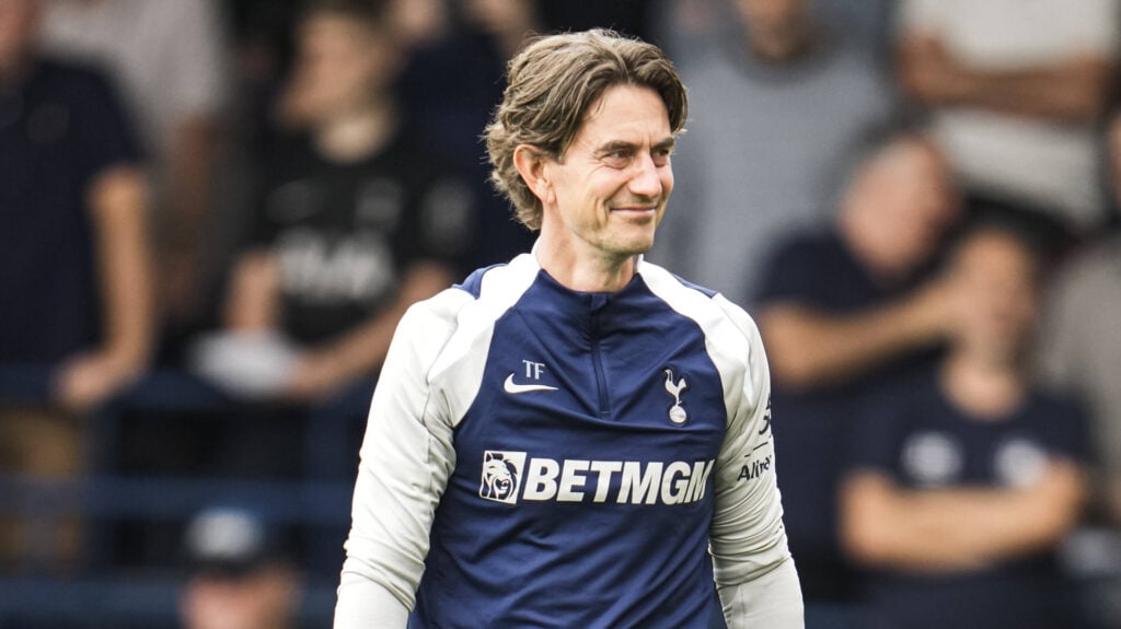 Thomas Frank smiling in Tottenham tracksuit