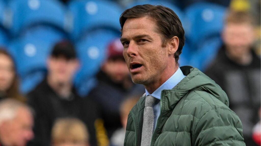 Burnley boss Scott Parker stands with his mouth open on the touchline.