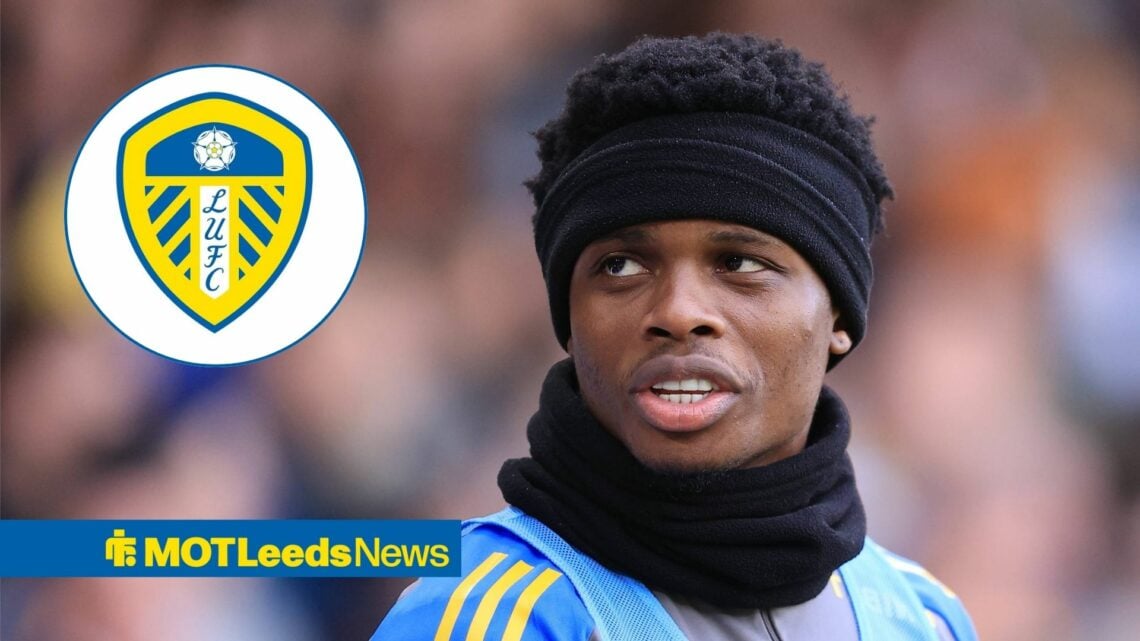 Largie Ramazani looking at the Leeds United badge.