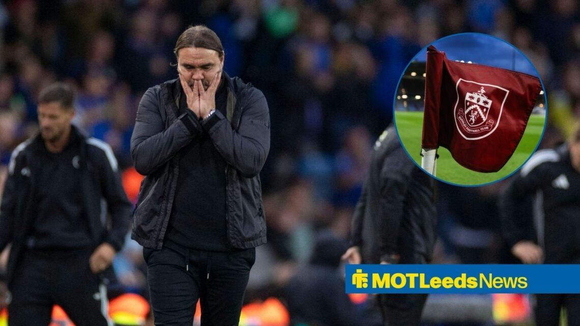 Daniel Farke with head in heads with Burnley flag in circle