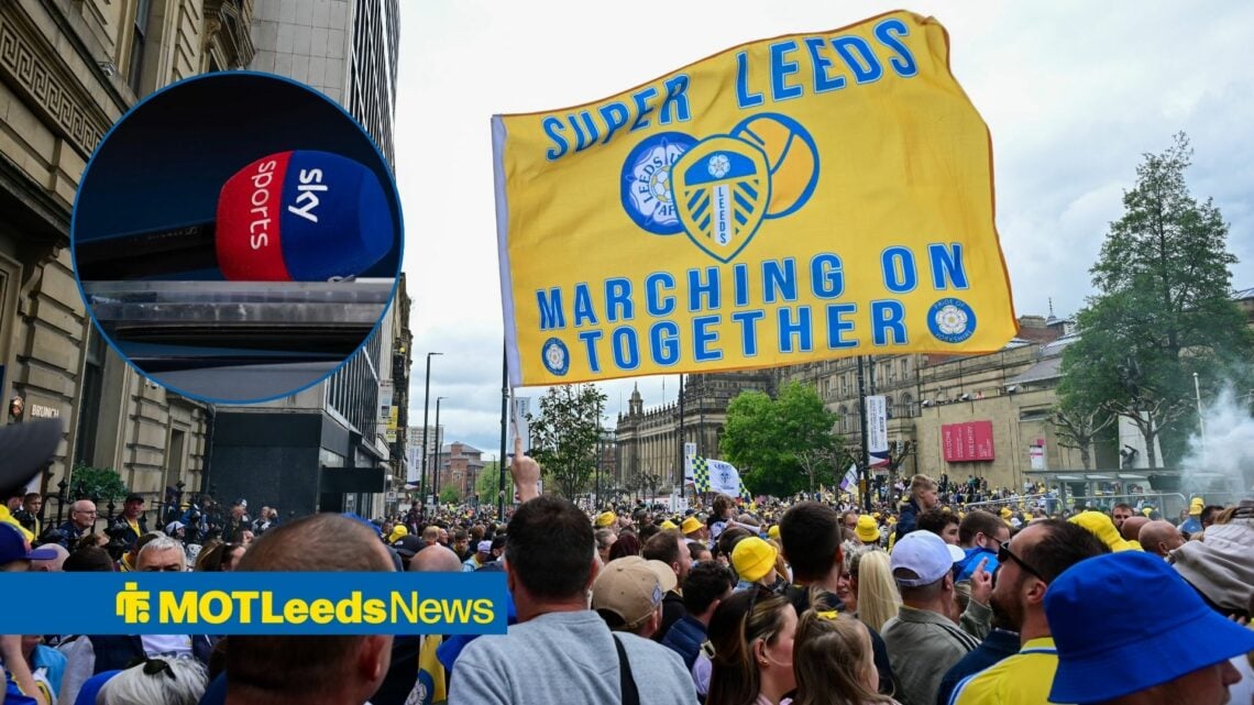 Leeds fans with banner with Sky Sports microphone in circle