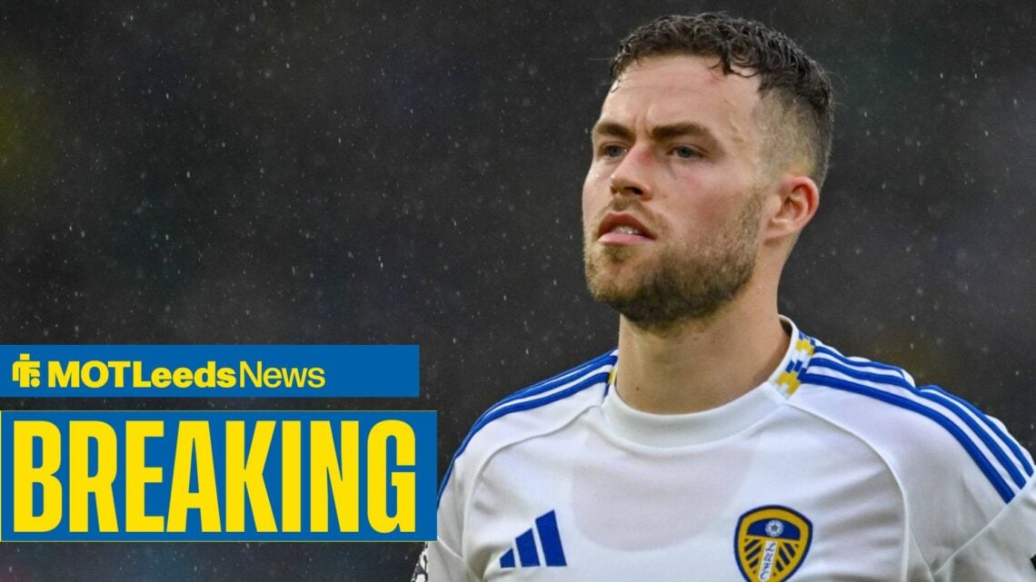 Gabriel Gudmundsson straight-faced in pouring rain with breaking news banner