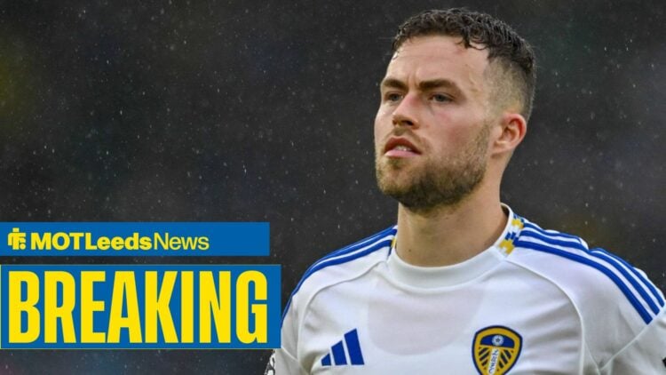 Gabriel Gudmundsson straight-faced in pouring rain with breaking news banner