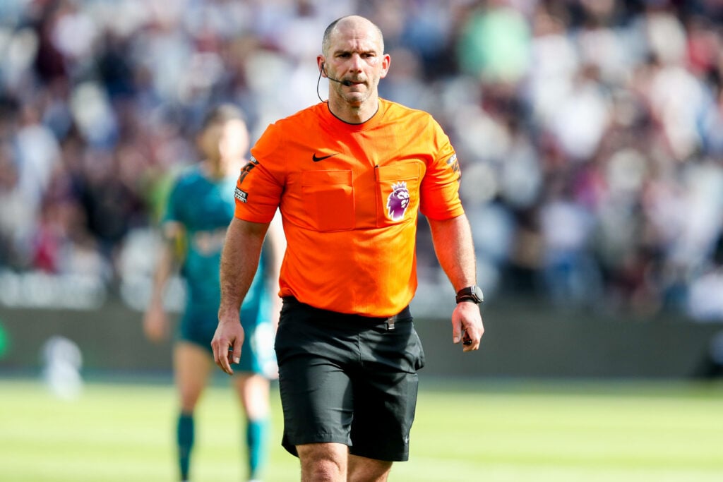 Tim Robinson in charge of Premier League match in orange attire