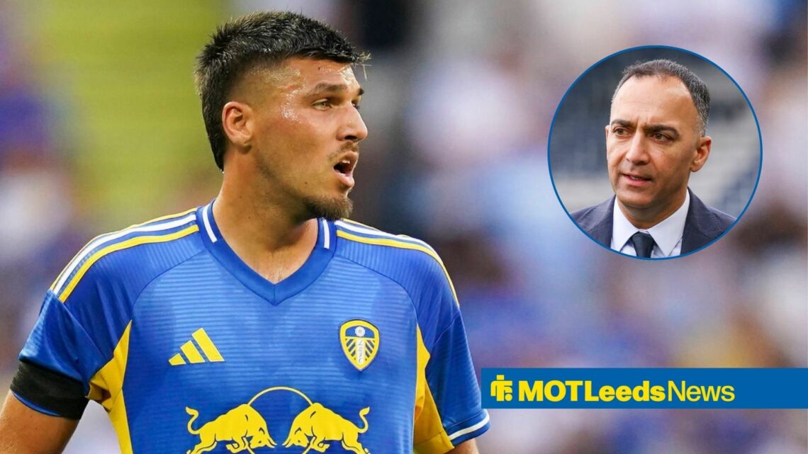 Joel Piroe looks in the direction of Paraag Marathe with a concerned look. Marathe looks back with a serious look.