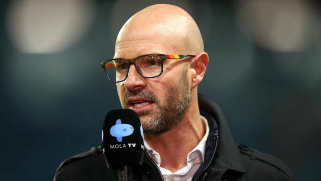 Danny Mills speaking into a mircophone