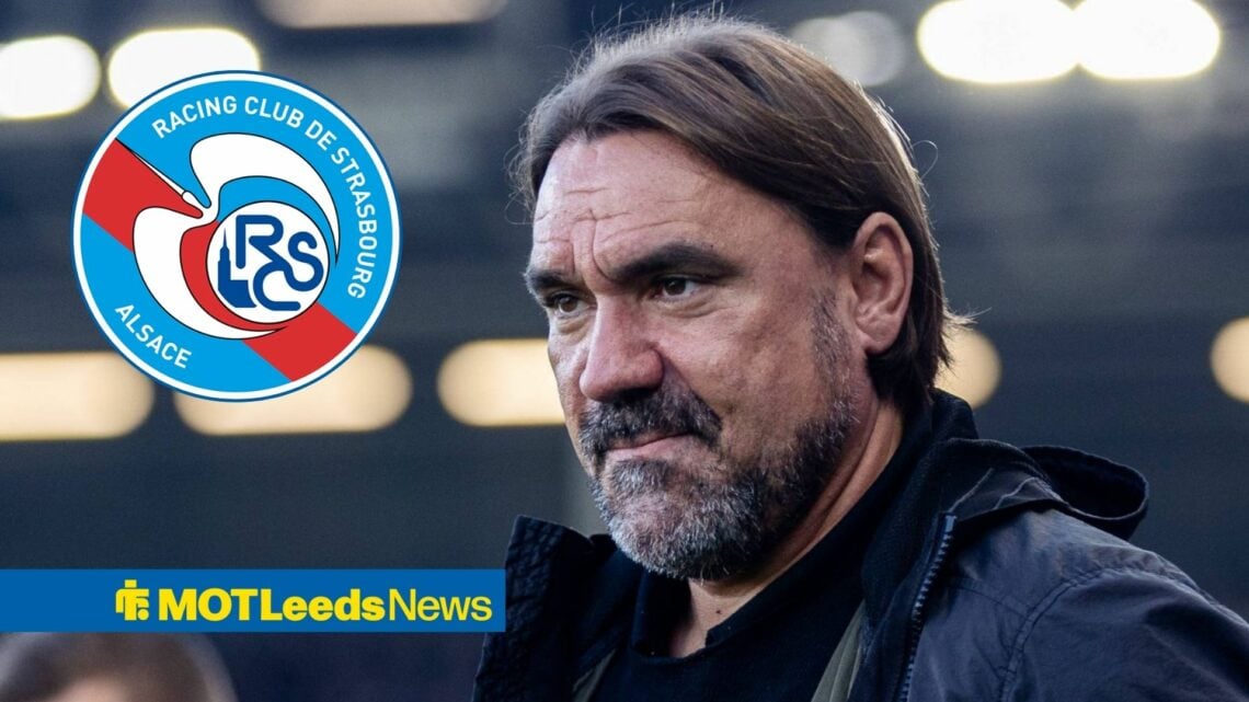 Daniel Farke looking at Strasbourg badge in circle