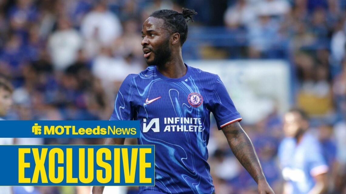 Raheem Sterling looking to the left in Chelsea home shirt