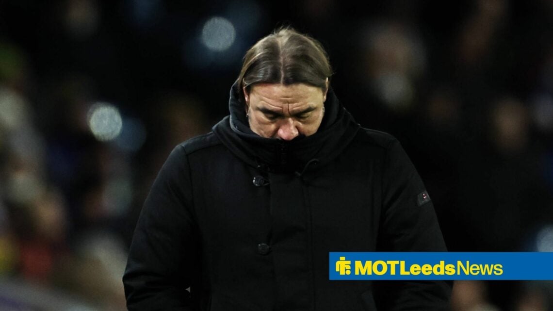 Daniel Farke looks downcast in a large black coat