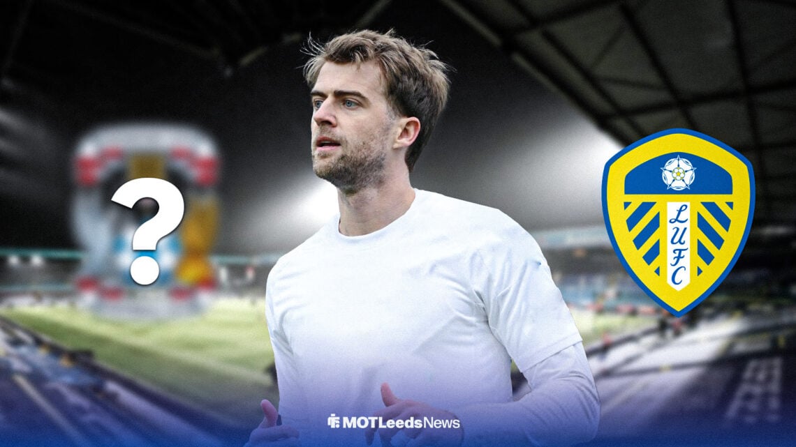 Patrick Bamford in a plain shirt at Elland Road alongside a Leeds United and Coventry City badge