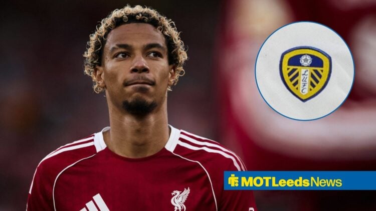 Hugo Ekitike looking at a Leeds United badge.