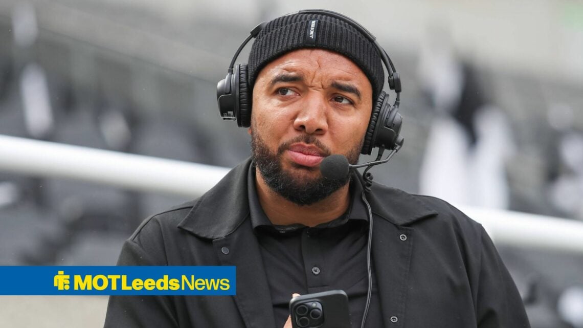Troy Deeney wearing a hat and a headset