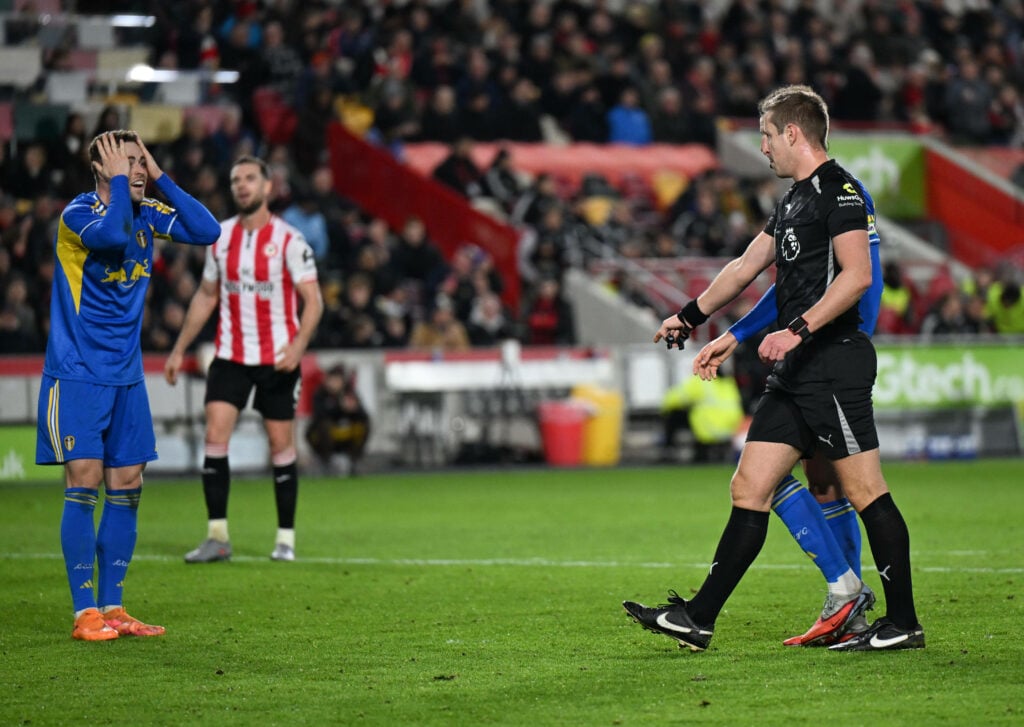 Gabriel Gudmundsson with head in hands as John Brooks awards initial Brentford penalty v Leeds