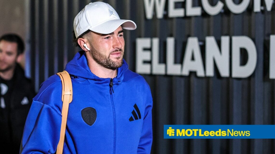 Jack Harrison walking into Elland Road wearing earphones.