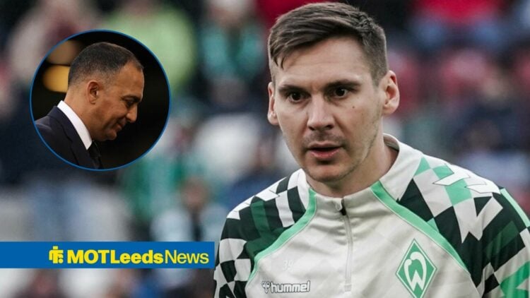 Paraag Marathe smiling at the floor in the direction of Max Wober