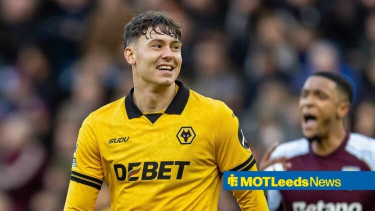 Jorgen Strand Larsen smiling in a Wolves kit.