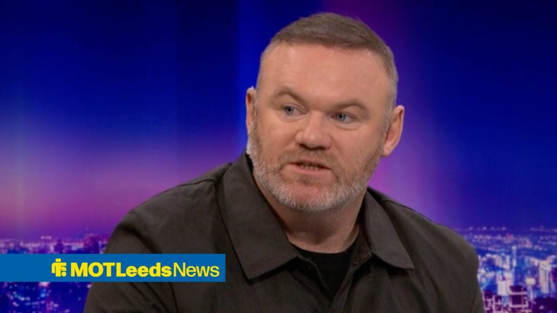 Wayne Rooney looking to his right.