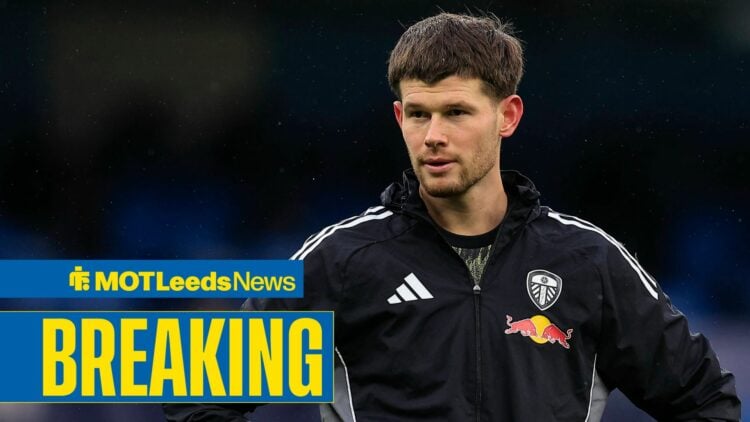 Illan Meslier looking to the left with his arms down by his side.