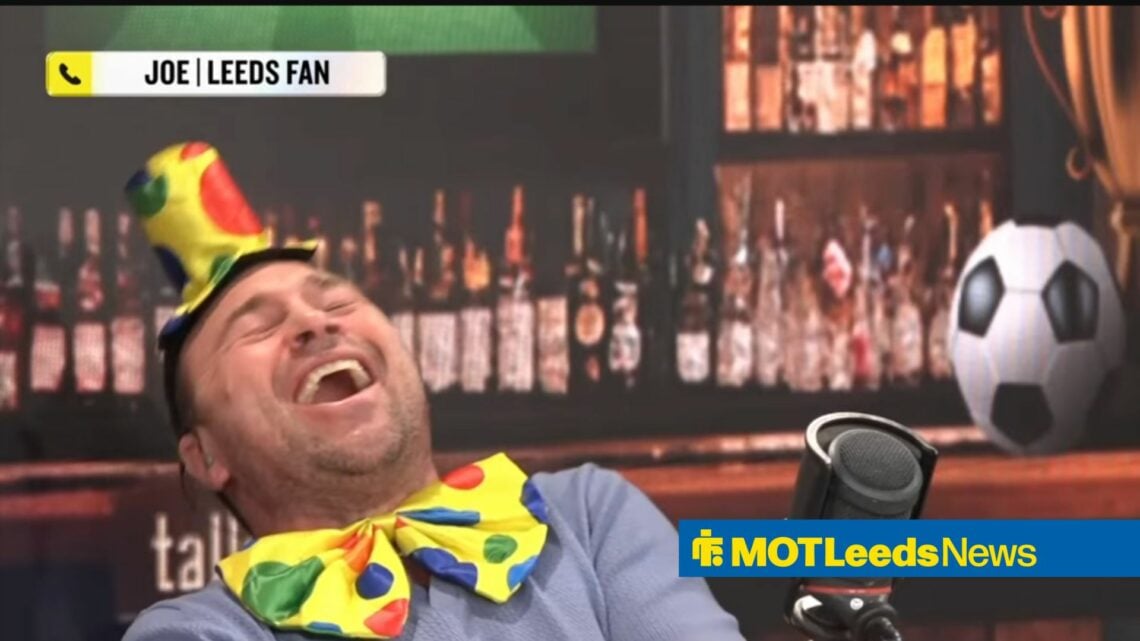 Jason Cundy laughs while wearing a clown outfit