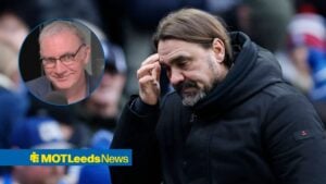 Kieran Maguire looking in the direction of Leeds manager Daniel Farke, who is managing a Premier League game.