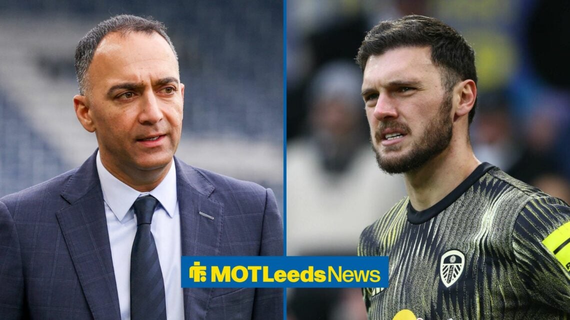 Leeds United owner, Paraag Marathe, looking in the direction of Leeds united goalkeeper Lucas Perri, who is warming up in training gear.