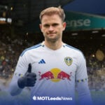 Southampton star Leo Scienza in a Leeds United shirt inside of Leeds United's stadium, Elland Road.