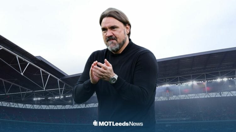 Leeds United boss Daniel Farke clapping with Wembley Stadium in the background.
