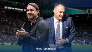 Leeds United manager Daniel Farke applauding, with Paraag Marathe alongside him and Elland Road in background