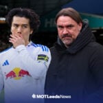 Leeds United midfielder Ao Tanaka puts his hand over his mouth, next to a concerned-looking Daniel Farke