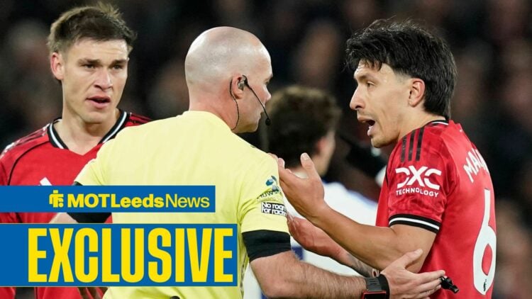 Paul Tierney speaks to Lisandro Martinez after sending off the Man United defender